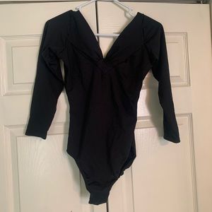 Black 3/4 length leotard.